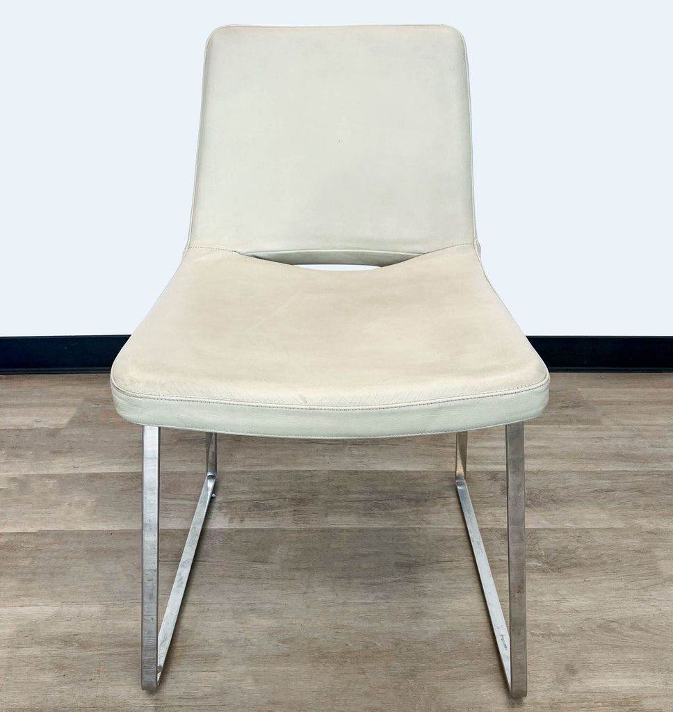 Beige leather Tui Lifestyle dining chair with sleek chrome base, front view.