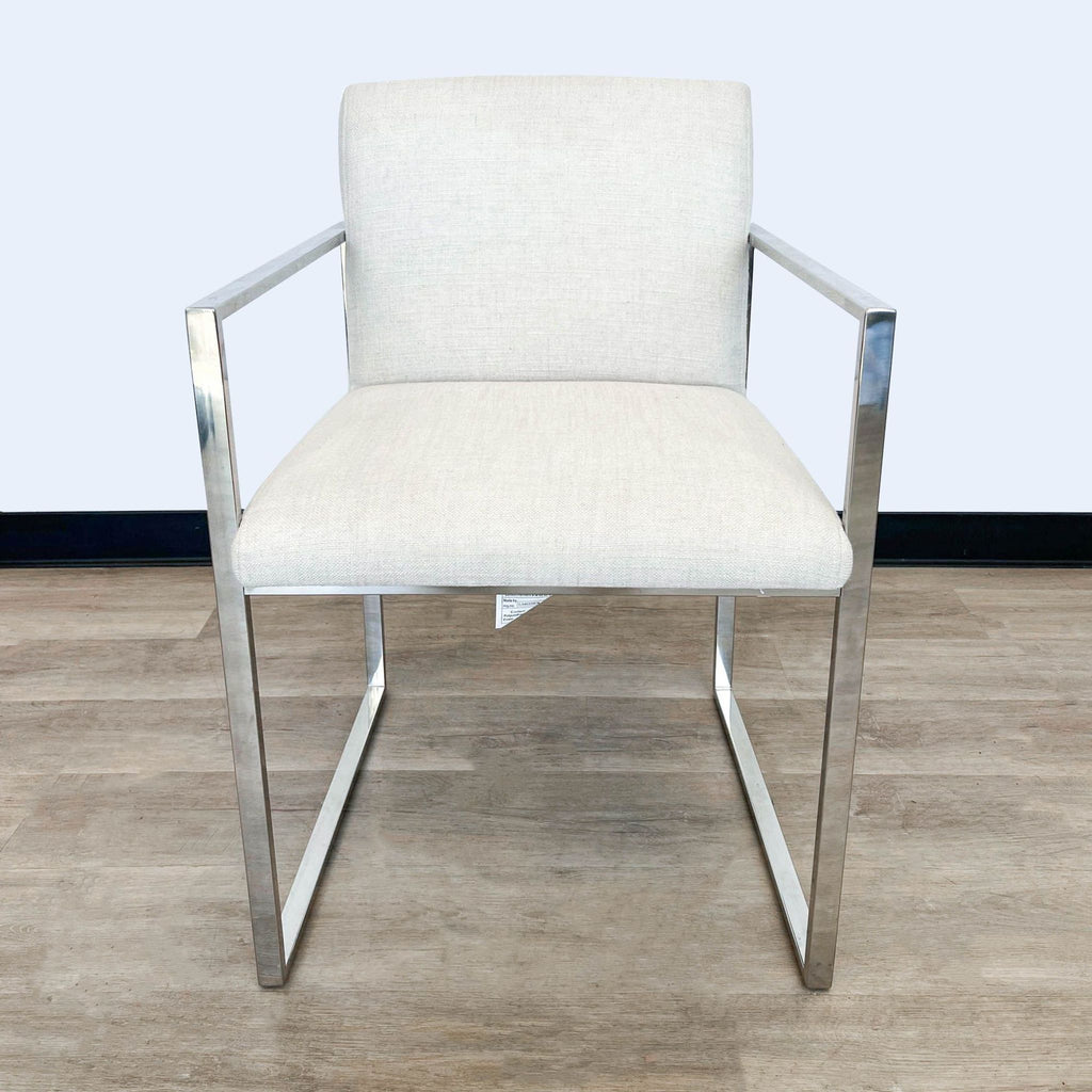Reperch brand contemporary dining chair with sleek metal frame and linen-upholstered seat.