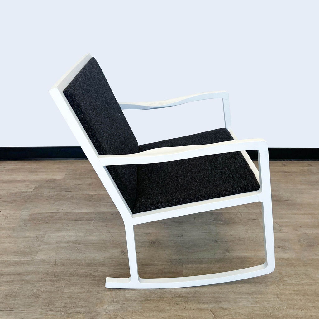Side view of an elegant HD Buttercup white and black rocking chair.