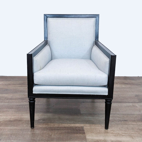 Reperch modern lounge chair with black frame and light upholstery, front view.