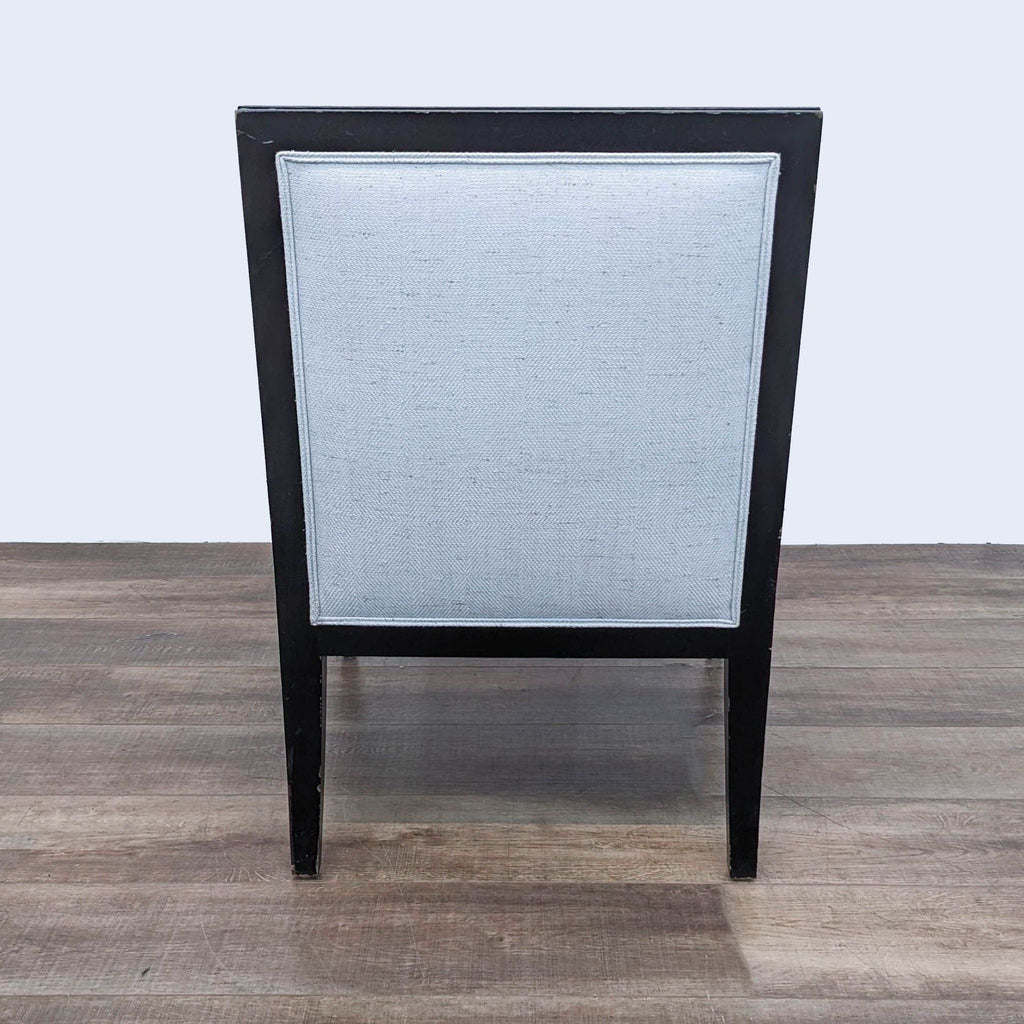 Sleek Black-Framed Lounge Chair with Light Upholstery