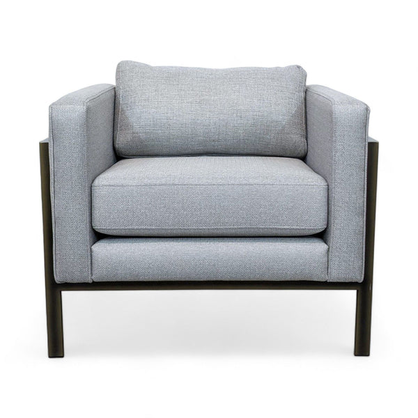 Front view of a gray lounge chair with a metal frame and textured upholstery.
