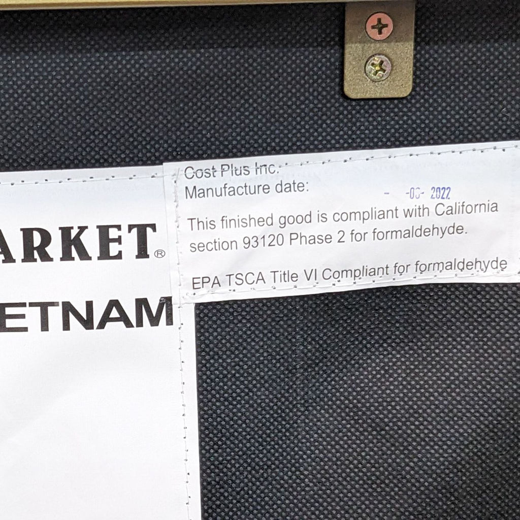 Product label on the lounge chair indicating compliance with formaldehyde regulations.