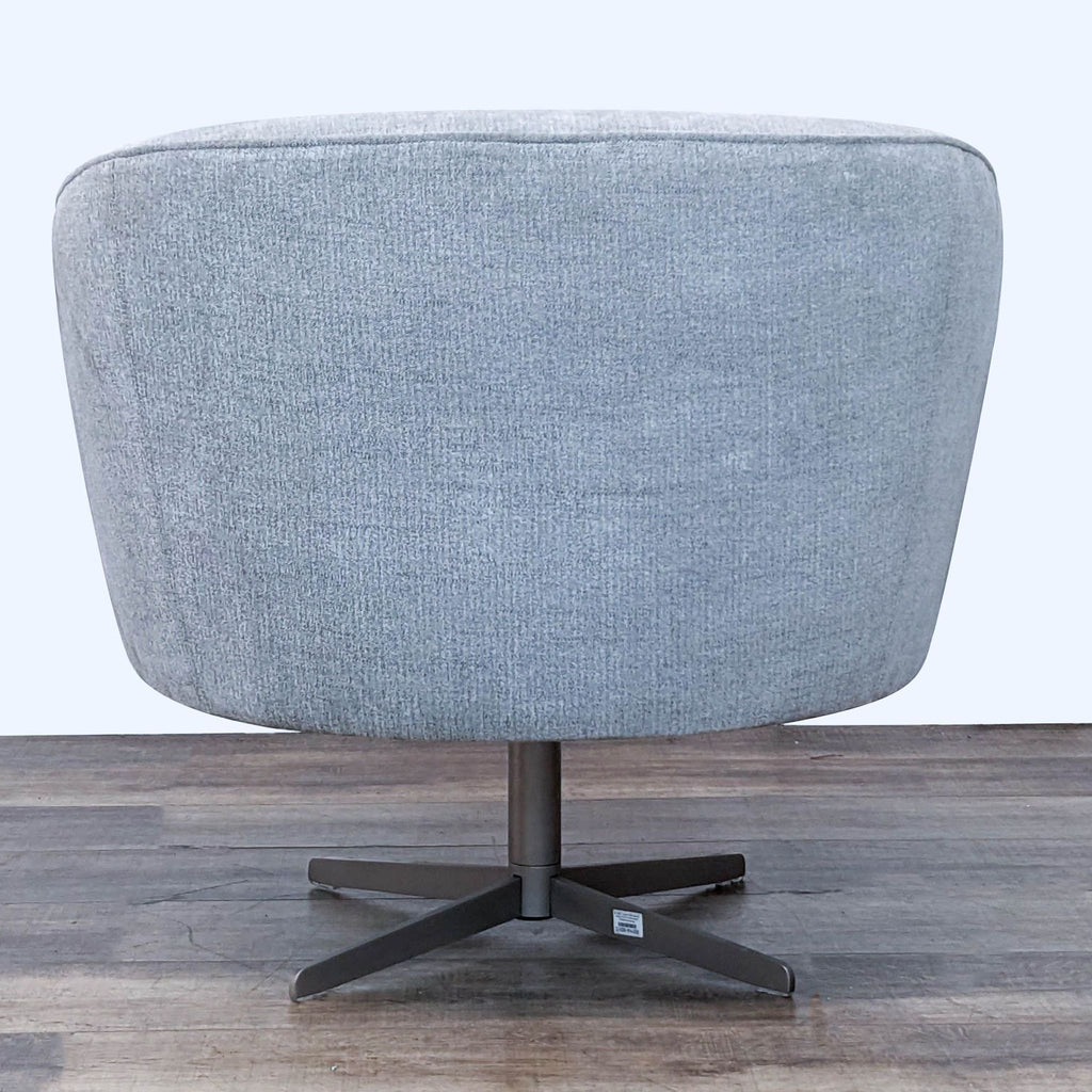 3. Sleek design Four Hands Oslo Dallas chair with a silver swivel base and soft grey fabric, ideal for modern lounging.