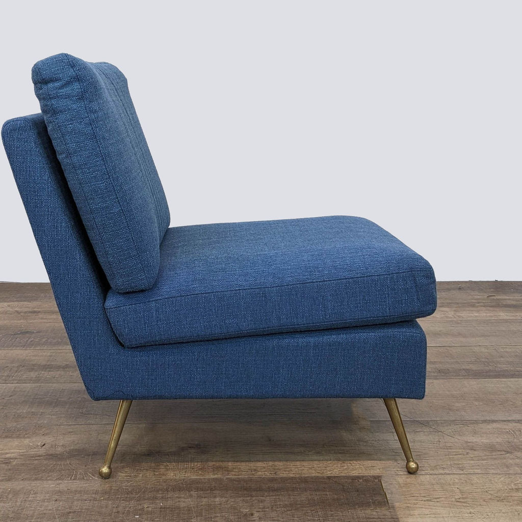Side view of a comfortable navy blue Reperch lounge chair, showcasing its sleek design and golden leg details.