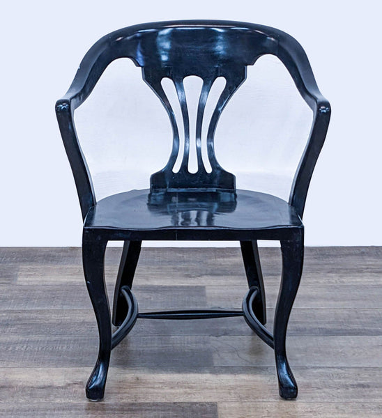 Reperch brand chair with a unique curved backrest and armrests in black lacquer finish, frontal view.