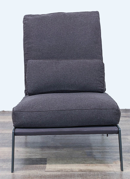 1. Arc Lounge Chair by Camerich with a blackened steel frame and charcoal cushions, front view on a wooden floor.