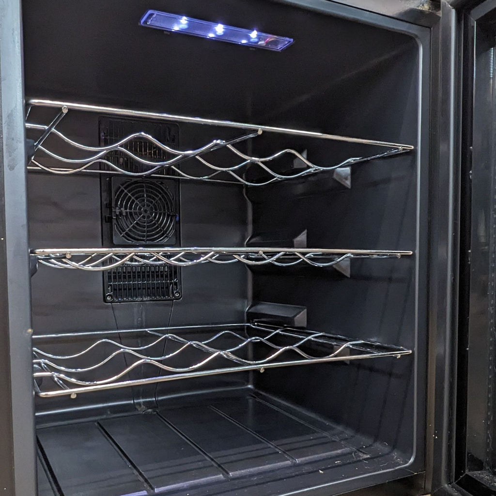 a stainless steel refrigerator with two shelves in the middle.