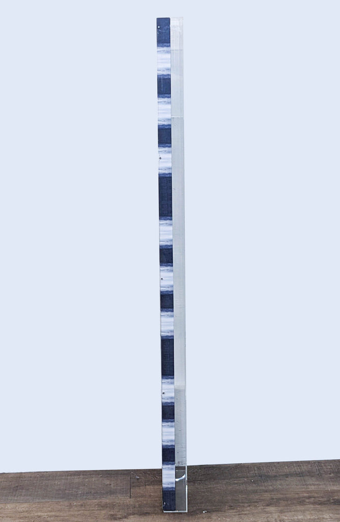 2. Side view of a tall, narrow artwork with alternating blue and white bands, part of the Benson-Cobb Gallery collection.