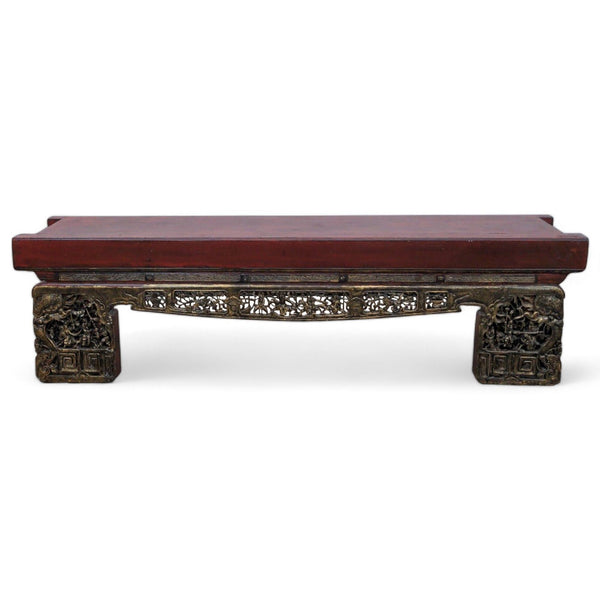 1. "Madera Home 79" long Asian Opium bench with intricate gold carving on front apron and legs, against a white background."