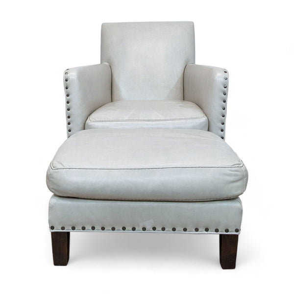 Off-white leather lounge chair with nailhead accents by Lee Industries, showcasing a high back and plush cushioning.