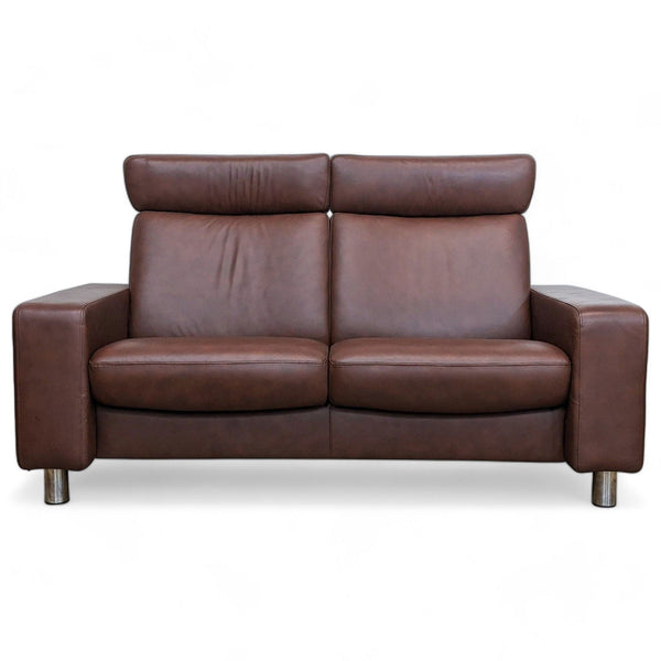 1. Front view of a modern Stressless leather loveseat with high back seats and metal legs.