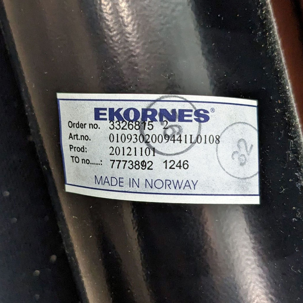 3. Close-up of a label on a Stressless product showing the brand Ekornes, 'Made in Norway', and order details.