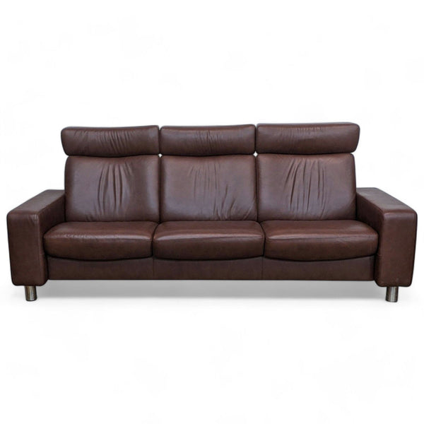 1. A brown leather 3-seat Stressless sofa with slightly reclined high backs and metal legs, isolated on a white background.
