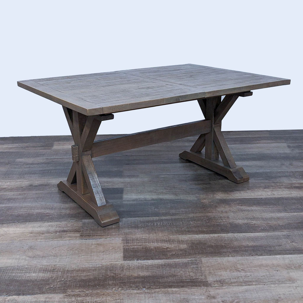 2. Close-up of Standard Furniture extendable dining table with trestle base, showcasing the wood texture and design without chairs.