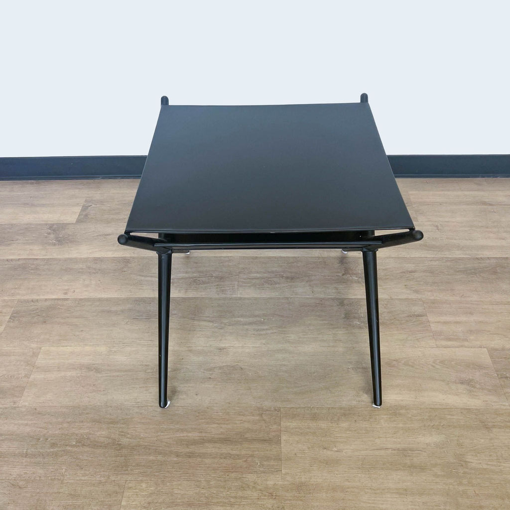 3. Reperch table displayed from a top-down perspective, emphasizing the clean lines and minimalist aesthetic on wooden flooring.