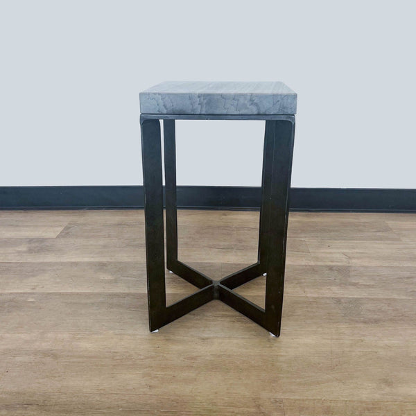 Reperch-branded side table with marble top and dark cross-legged frame, against a neutral background.