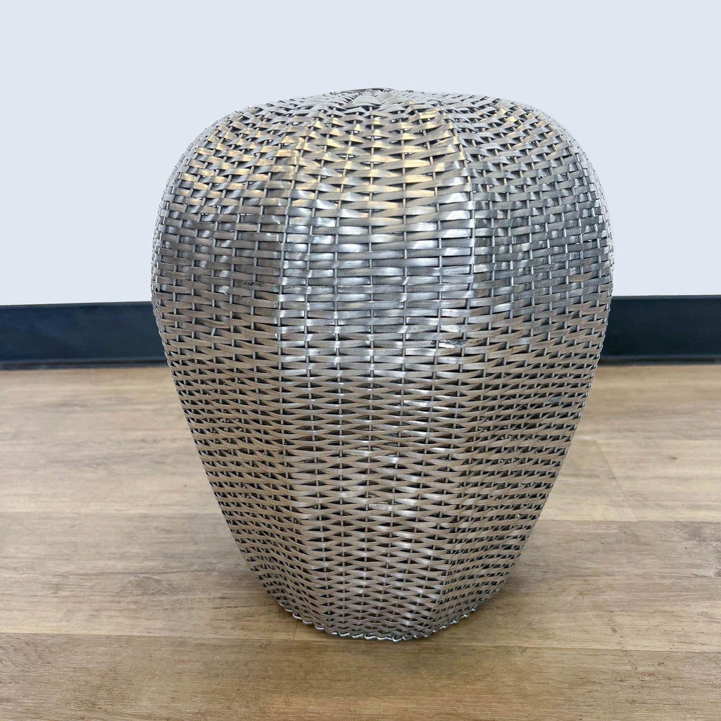 a large metal sculpture of a wire mesh table.