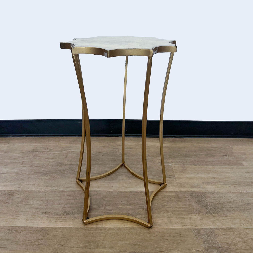 Elegant Reperch side table with textured top and metallic gold frame, shown at an angle.