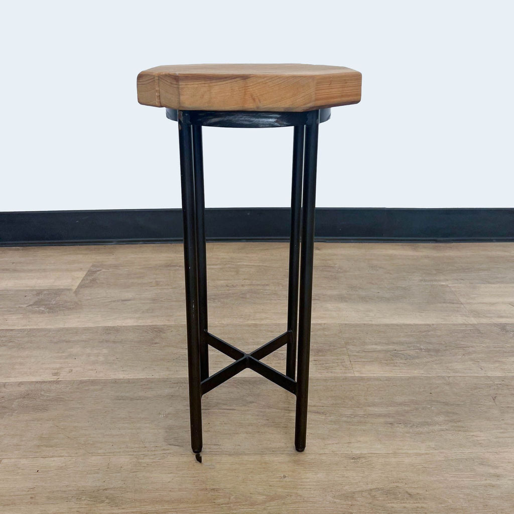 Compact Reperch console table featuring a wooden surface and metal base.