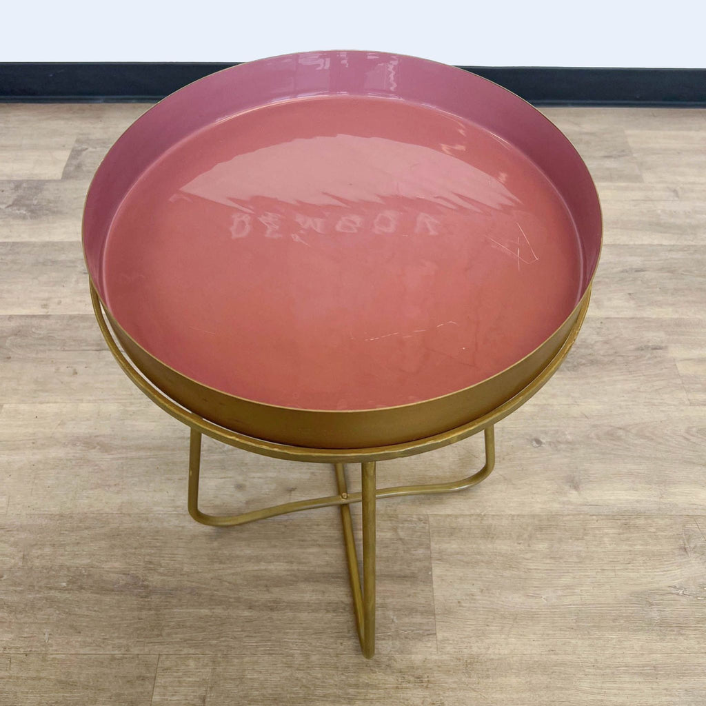 Reperch side table, pink top on gold tripod base, modern design.