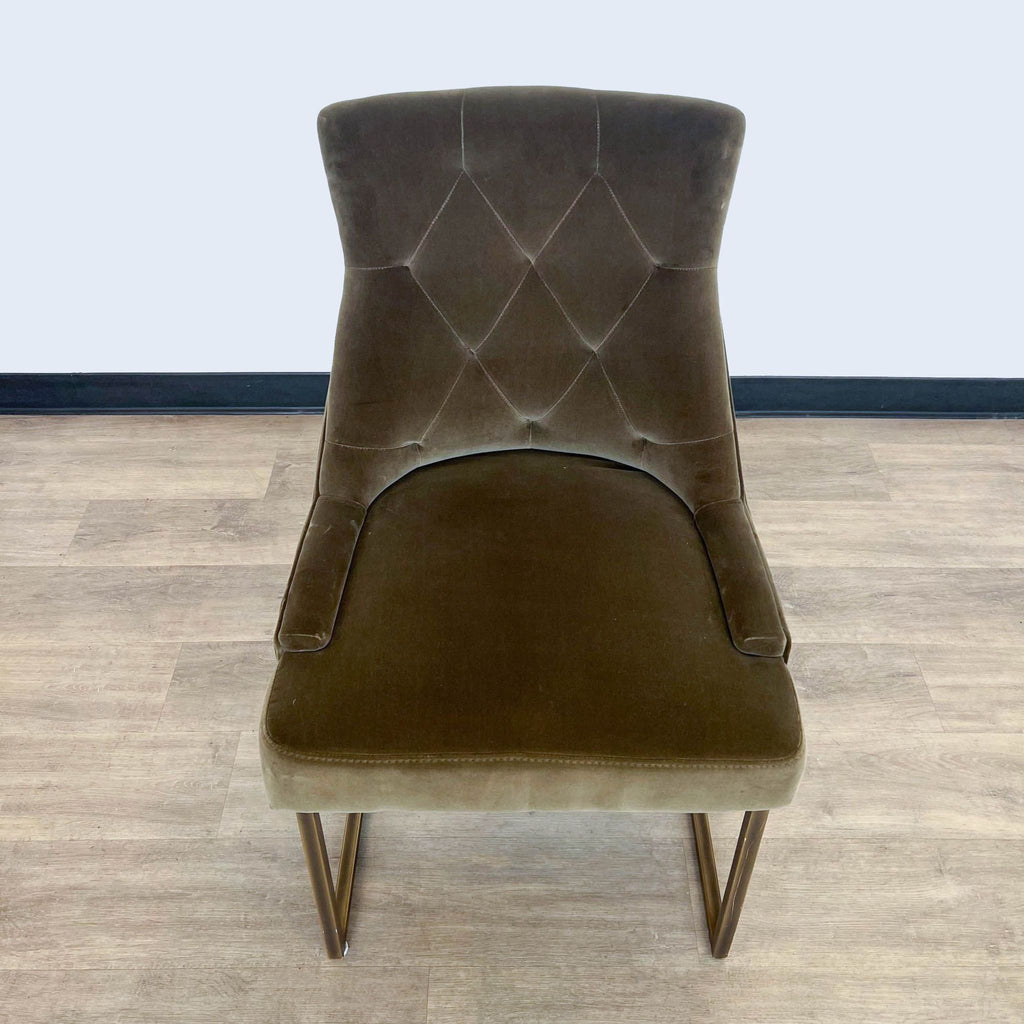 3. Back view of a velvet Rupert dining chair by Sonder Living demonstrating the tufted design with diamond patterns and metal legs.