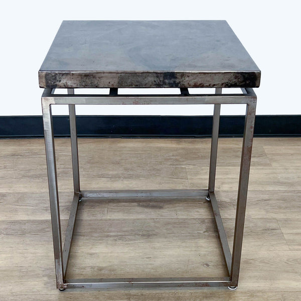 1. Acid-washed iron slab top Roman side table by Crate & Barrel, with oxidized iron square base, against a neutral background.