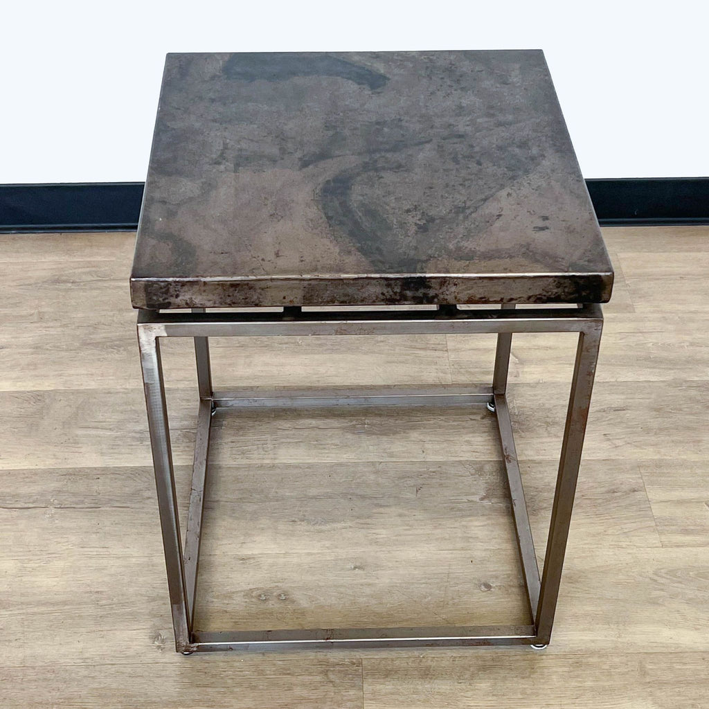 2. Crate & Barrel Roman table from Side & Console category, featuring acid-washed iron surface and oxidized iron frame, on wooden flooring.