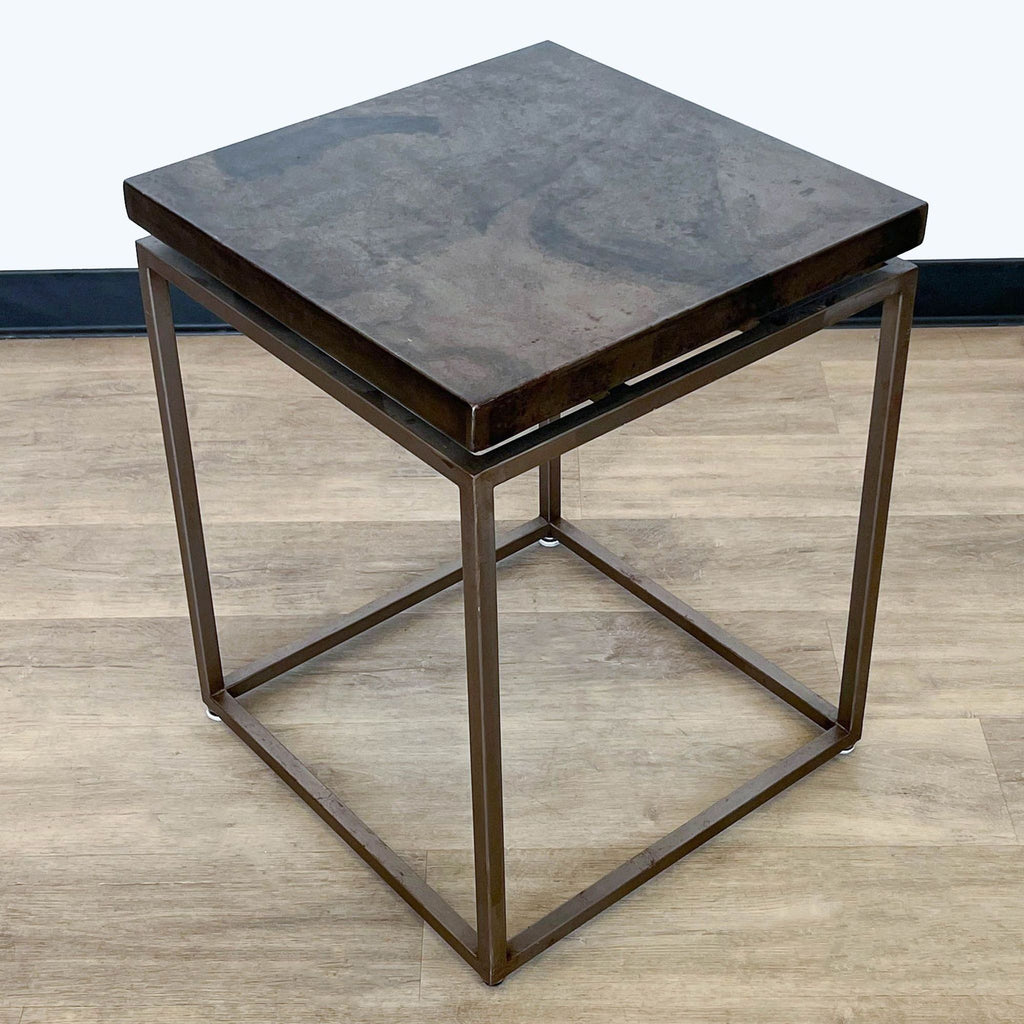 3. Square Roman side table with textured iron tabletop and open base design, from Crate & Barrel's Side & Console Table collection.