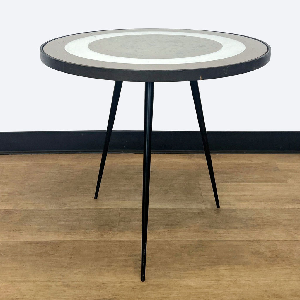 a round table with a circular design on a black and white background.