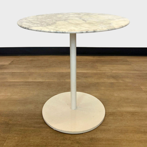 a round white marble side table in the style of [ unused0 ]