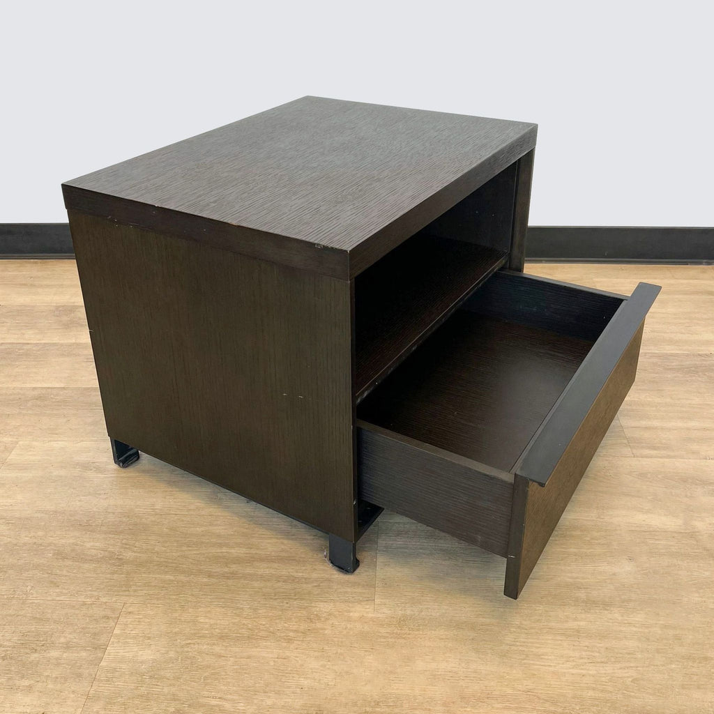 a dark wood bedside table with a drawer and a drawer.