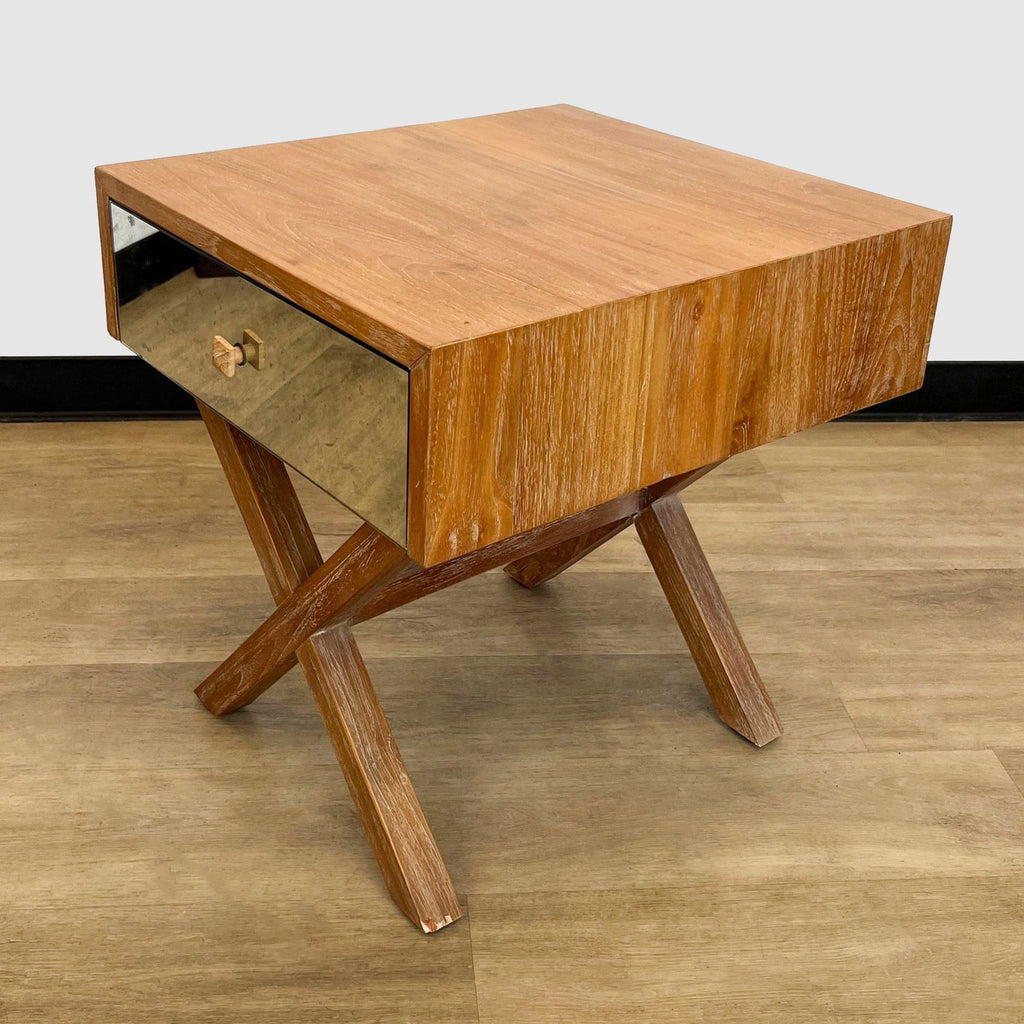 a mid century modern coffee table with a drawer.