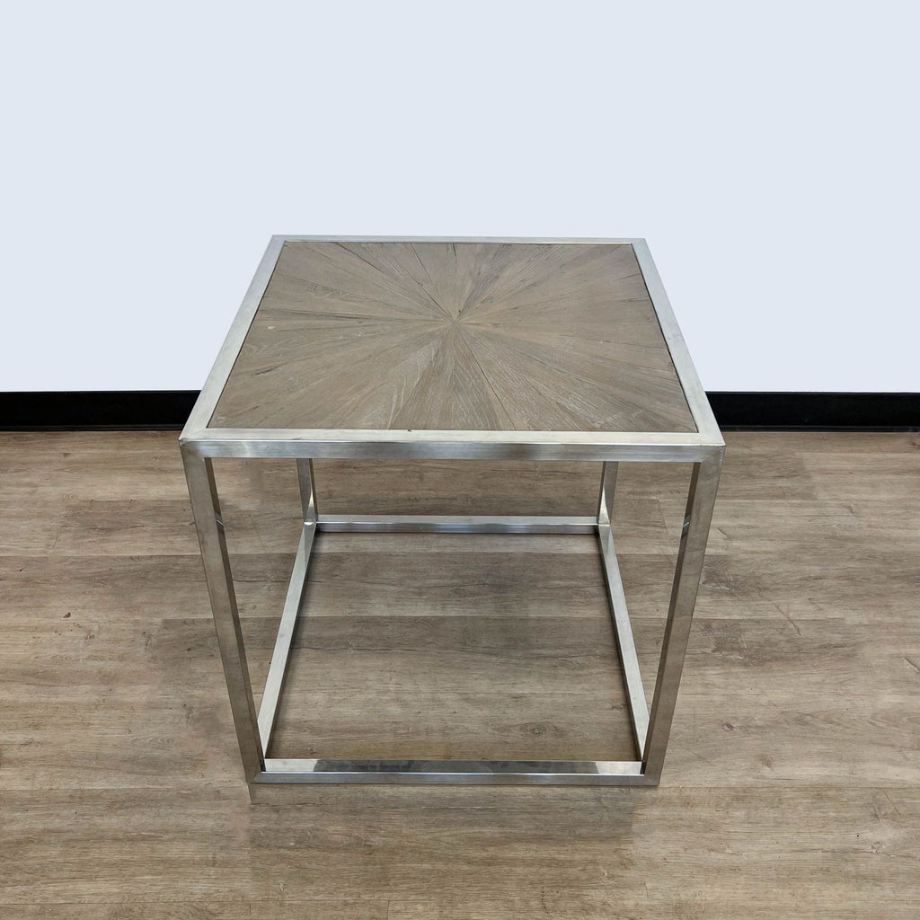 Square end table by Brownstone Furniture with wood inlay pattern and shiny metallic base.