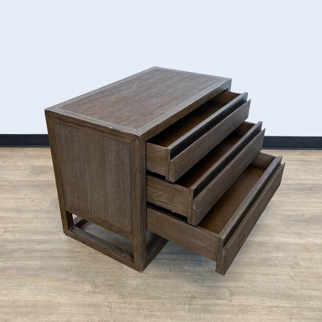 Open drawers of a square Brownstone Furniture end table, showcasing storage space.