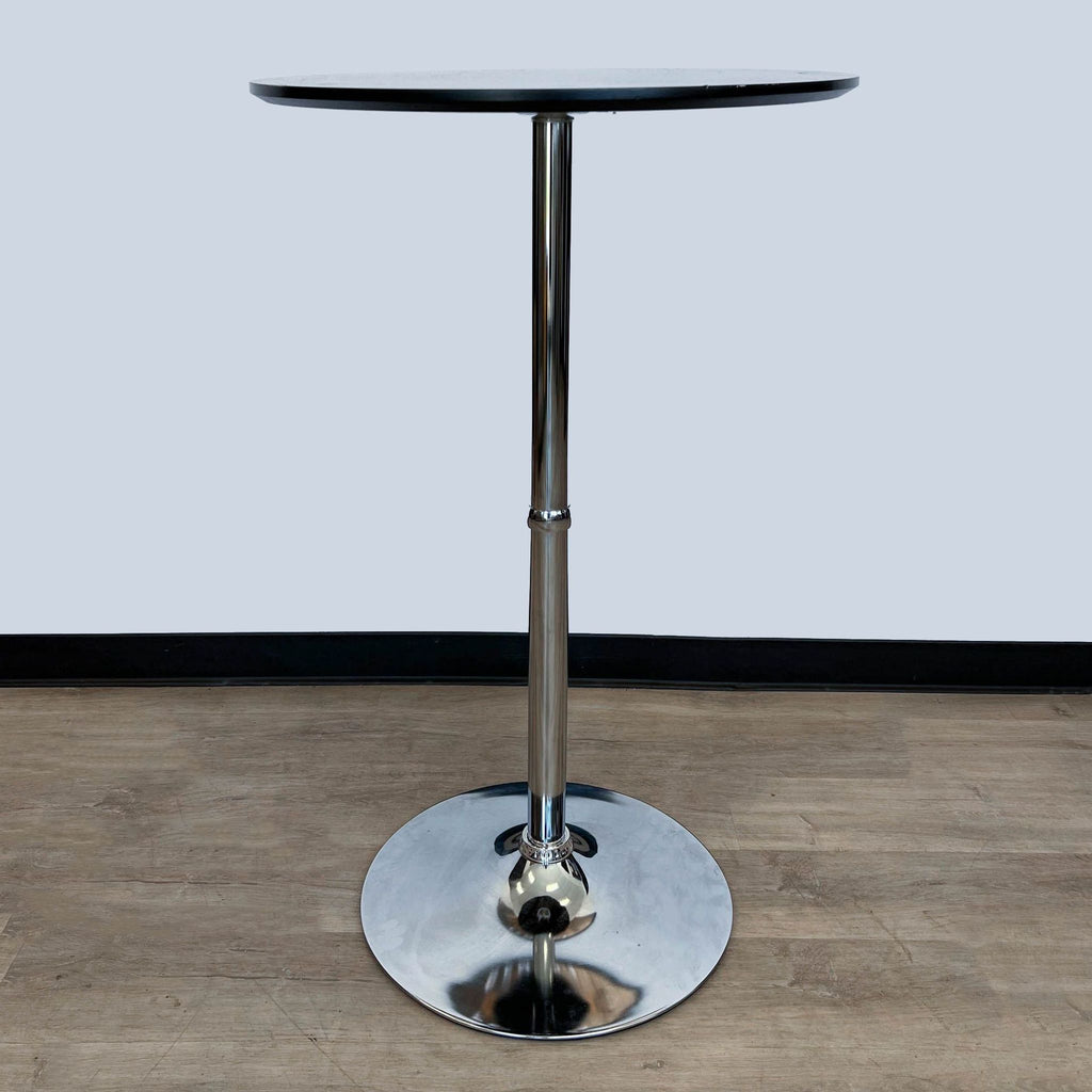 Reperch stylish dining table with round engineered wood top and chrome pedestal, angled view.