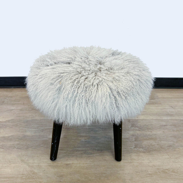 1. A Reperch brand 17-inch round stool with fluffy white shaggy fur and dark wooden legs on a wooden floor.