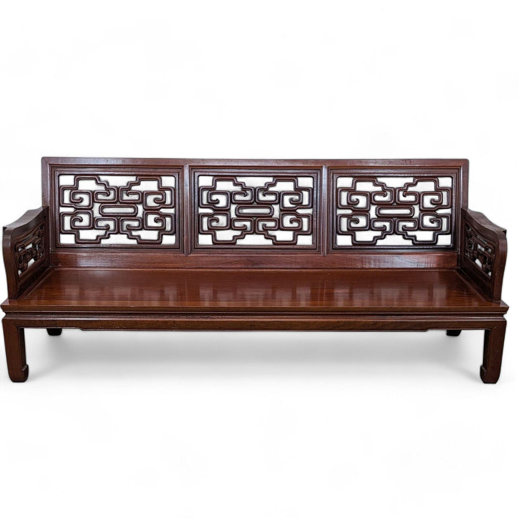 Solid wood Rosewood Reperch 3-seat sofa with traditional Chinese carved patterns on back and curved arms, front view.