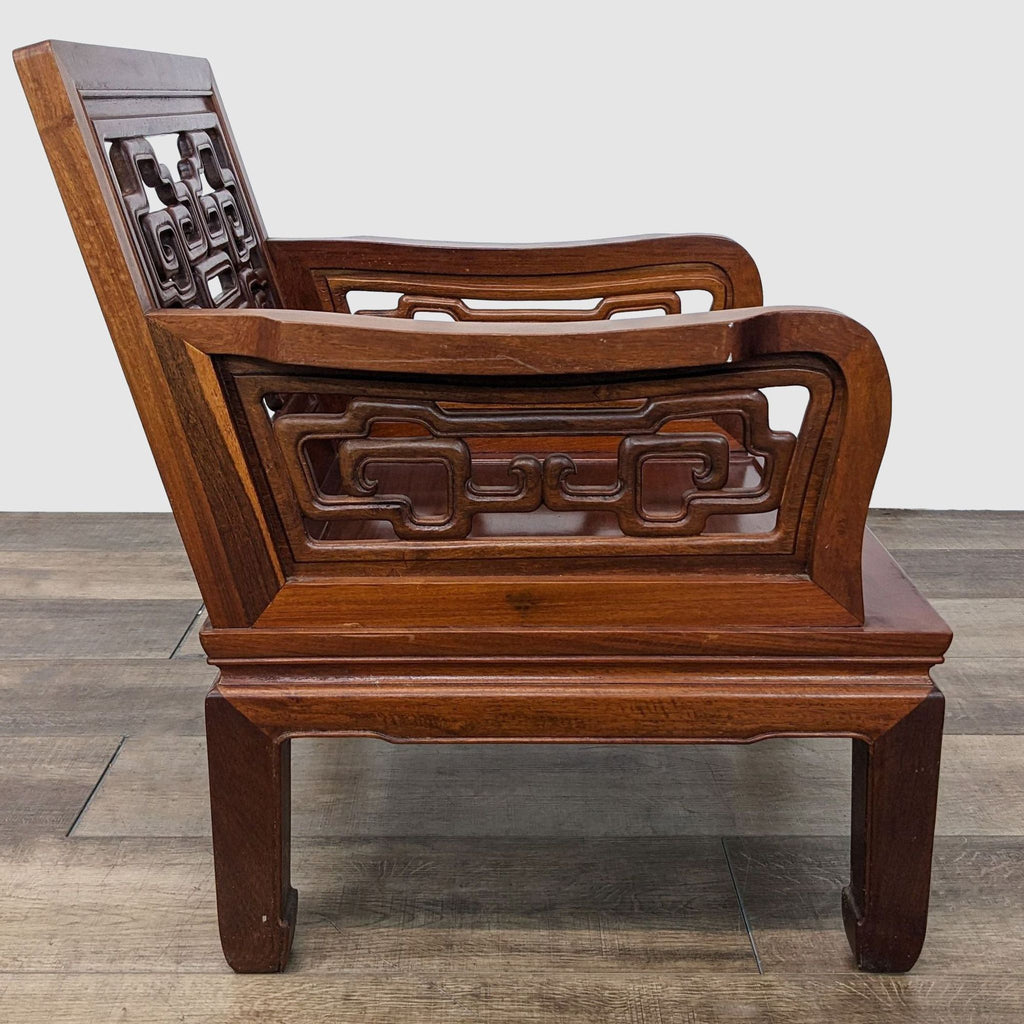 2. Asian-inspired Reperch solid rosewood chair showcasing side view with detailed armrest and leg carvings.