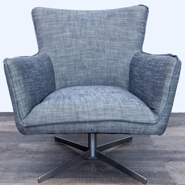 1. Front view of a Jacob Chair by Four Hands showing a contemporary gray wingback design with a silver swivel base on a wooden floor.