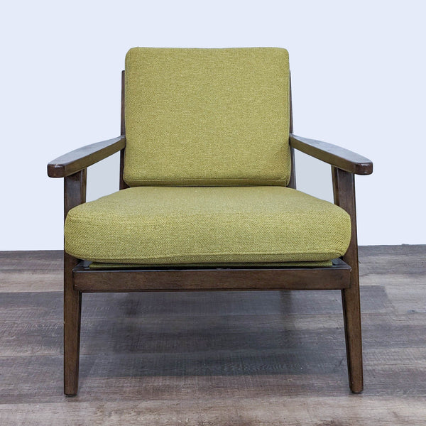 Front view of the Xander chair by World Market with a solid wood frame and yellow-green removable cushions in a mid-century modern style.