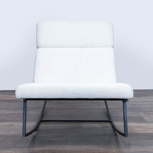 1. Gus Modern GT Rocker with a sleek, powder-coated frame and light grey cushions on a wooden floor.