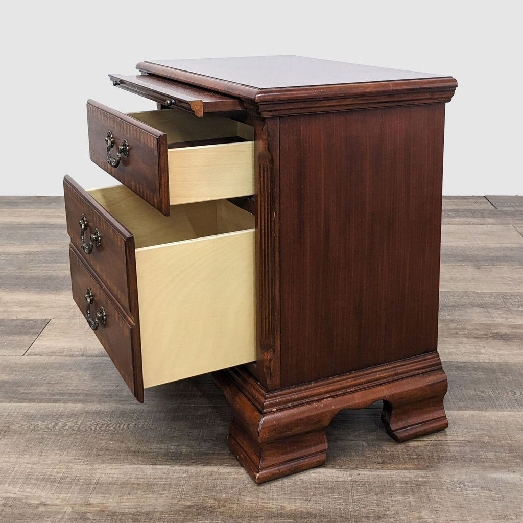 Traditional Reperch end table with drawer open, revealing interior and detailed inlay against a neutral background.
