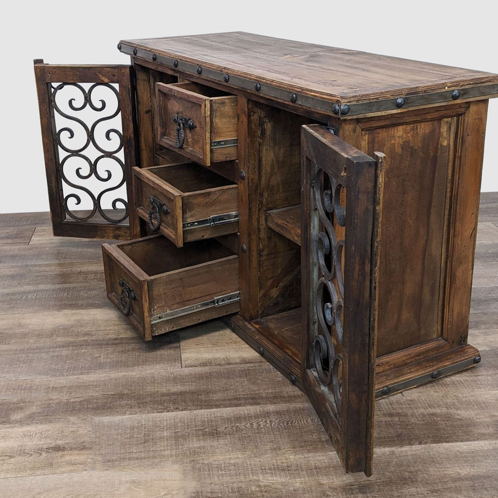 Chilean pine sideboard with open wrought iron doors revealing drawers, part of Pueblo Viejo's collection.