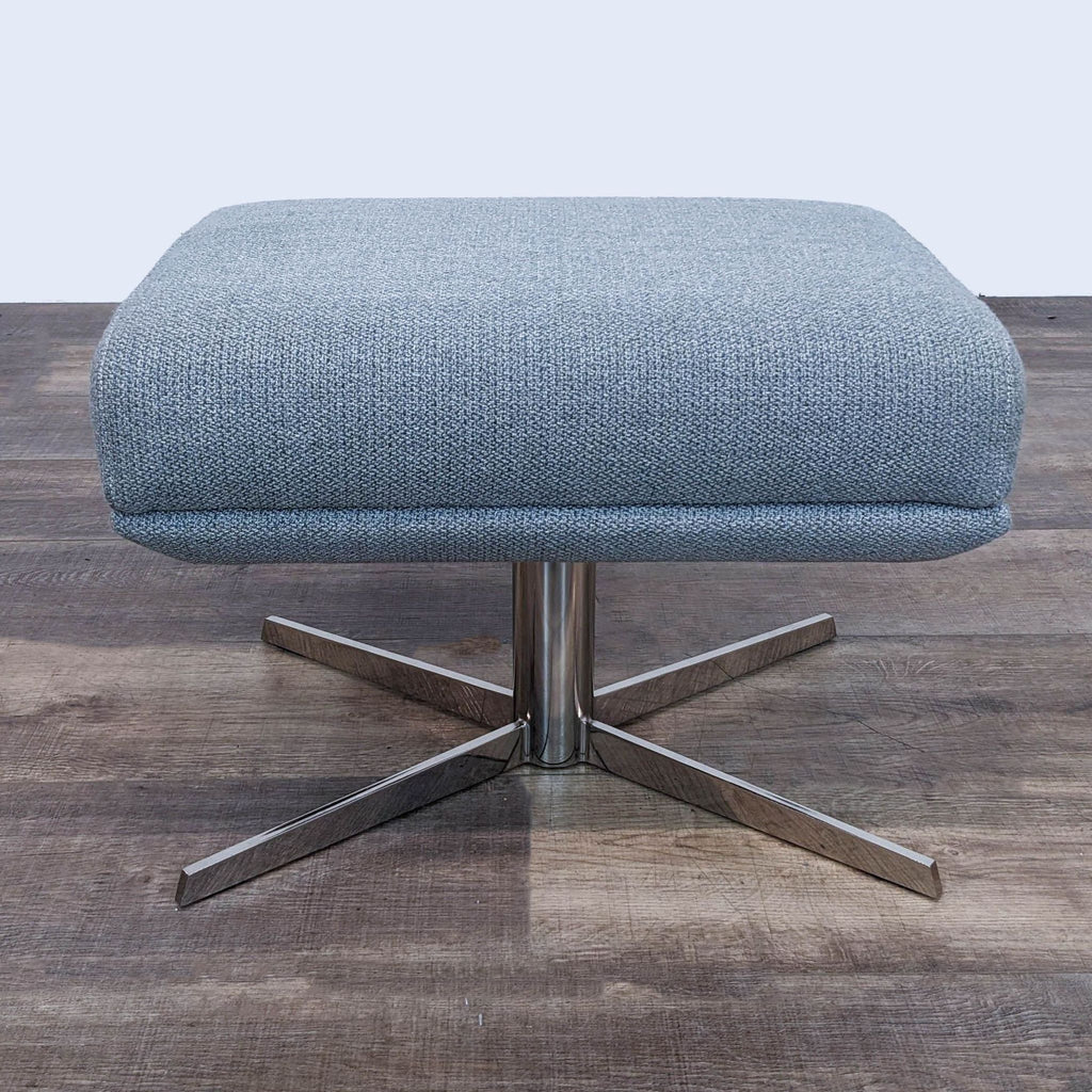 Modern and minimalist West Elm stool with gray fabric cushion and a five-point metal base.
