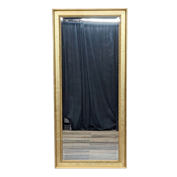 Beveled mirror with a gold wood frame by Reperch.