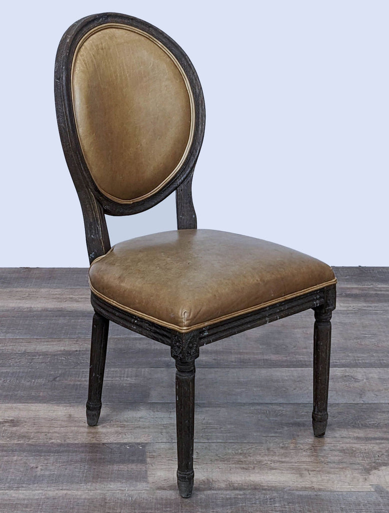 Reperch Vintage French Round dining chair showcasing its scrollwork and tapering columnar legs, three-quarter view.