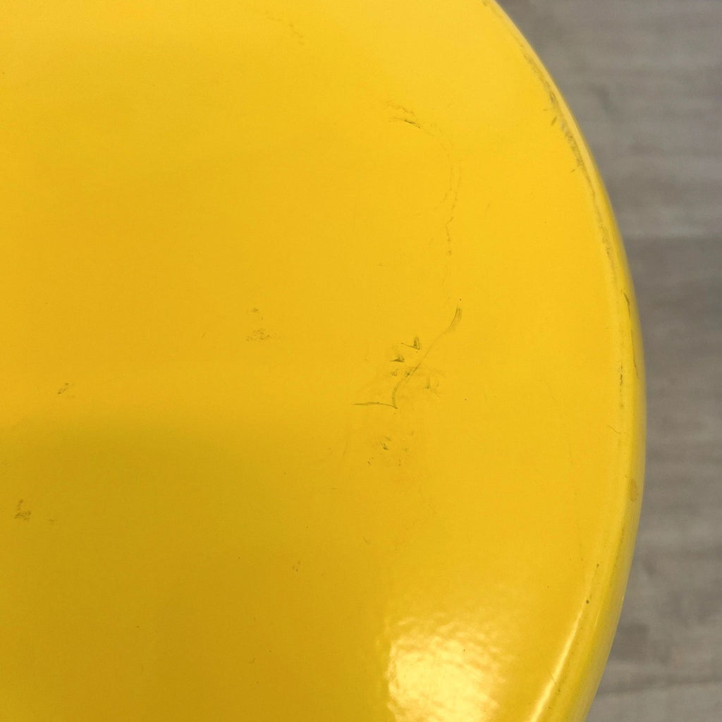3. Top view of a yellow Reperch side table showing surface details and minor wear marks.