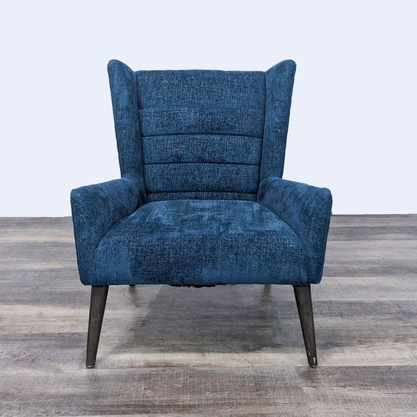 Front view of a Four Hands Hollis Chair with blue textured upholstery, channel tufting, and tapered wooden legs.