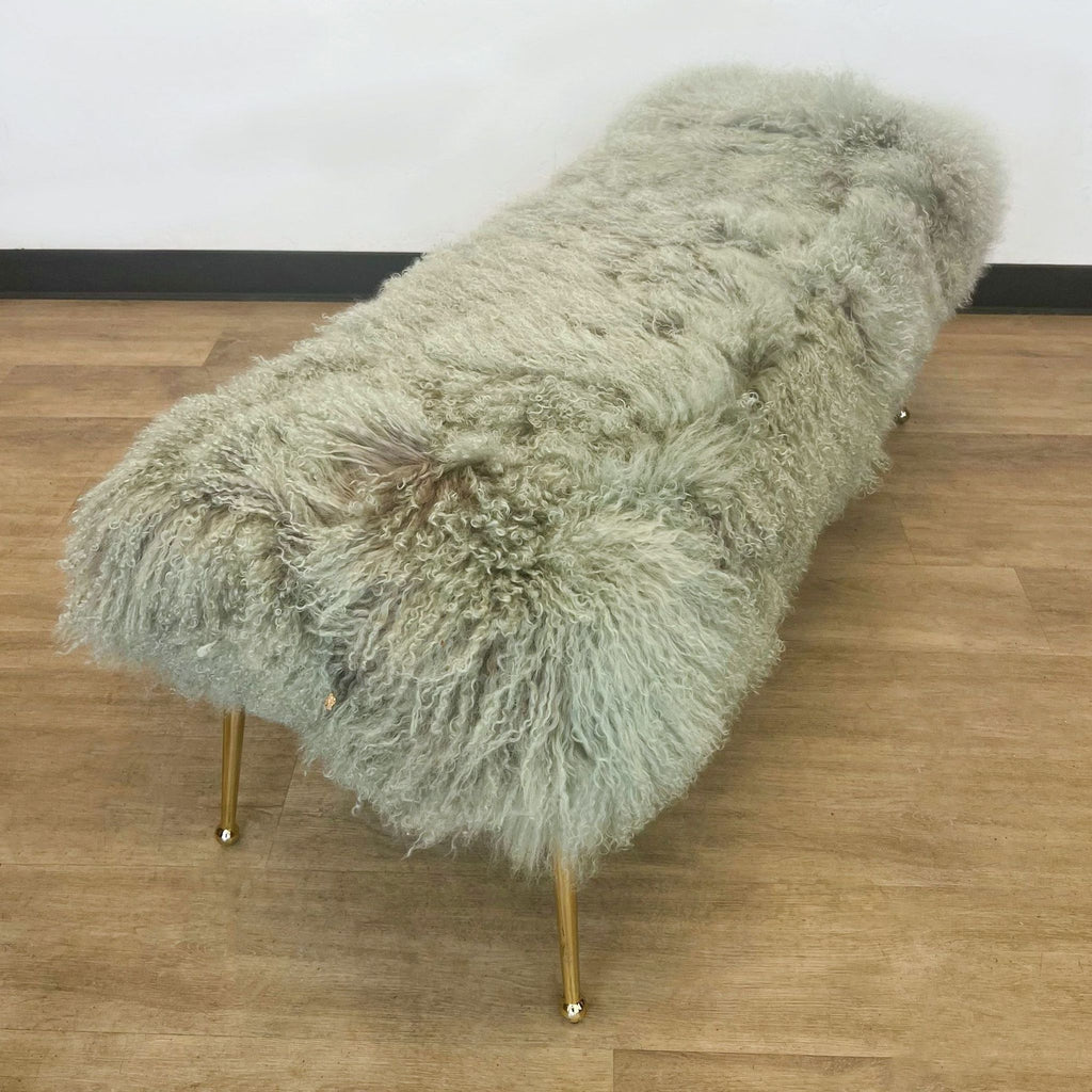 2. Luxurious H.D. Buttercup gray fur bench with golden legs, offering a textural decor element on wooden flooring.